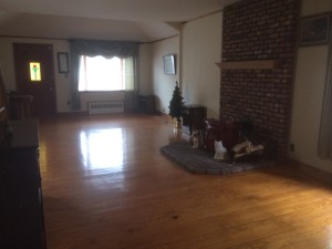 Open living/dining area with a wood burning stove.
